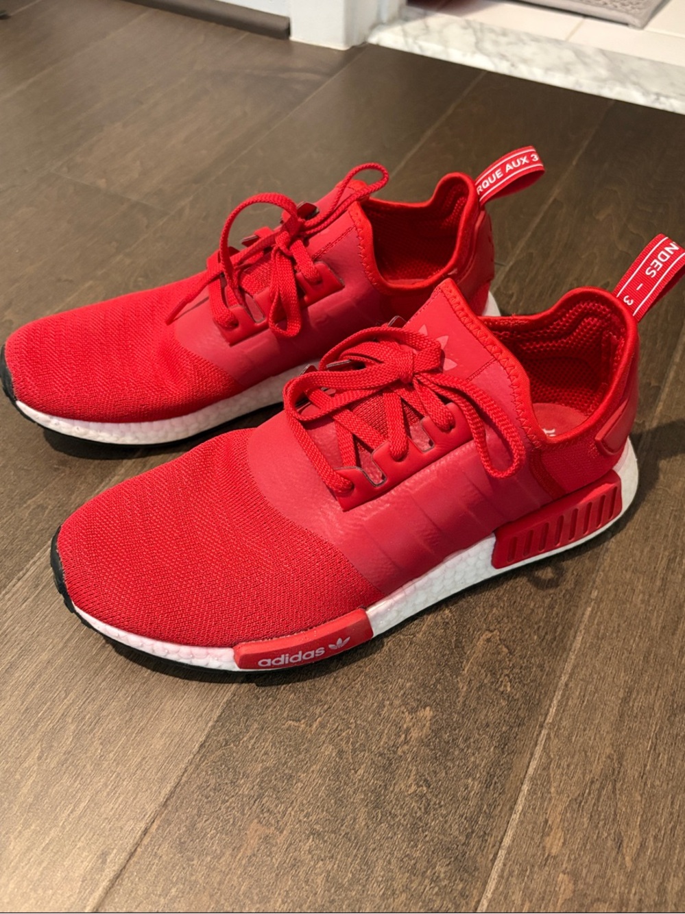adidas NMD_R1 Primeknit Sneakers in Red
